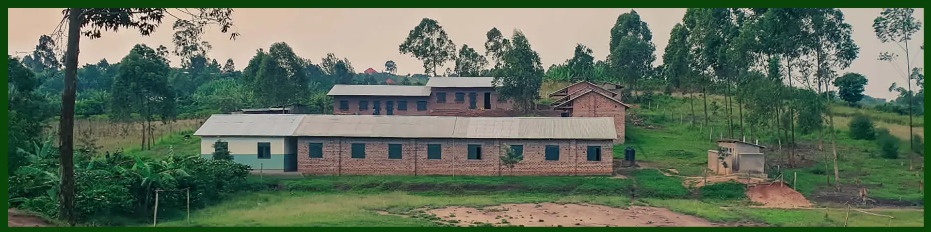 Mustard Seed Elementary School on a green hillside in Uganda